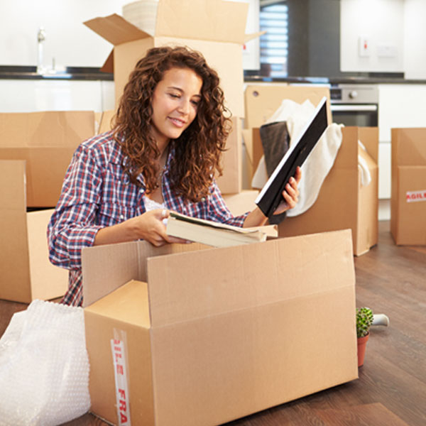 Woman packing a shipping box
