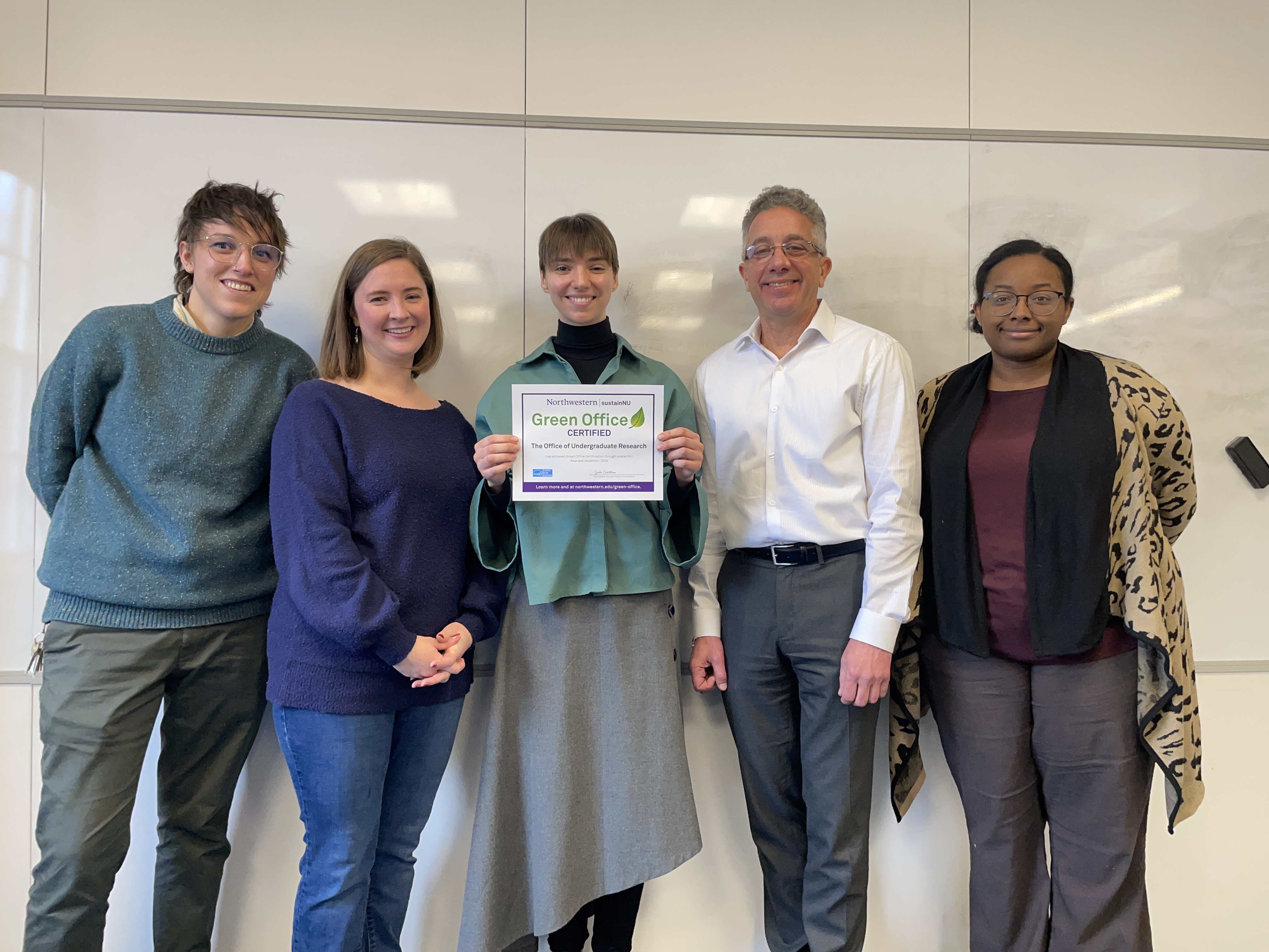 Five members of the Office of Undergraduate Research pose with their Green Office Certificate